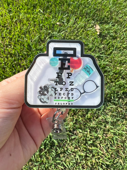 Ophthalmologists and optometrists badge reel, eye doctor , eye chart badge holder, interactive ID holder. Shaker badge clip